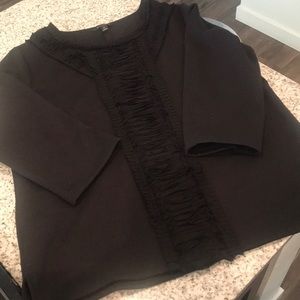 Textured, feminine black sweatshirt.